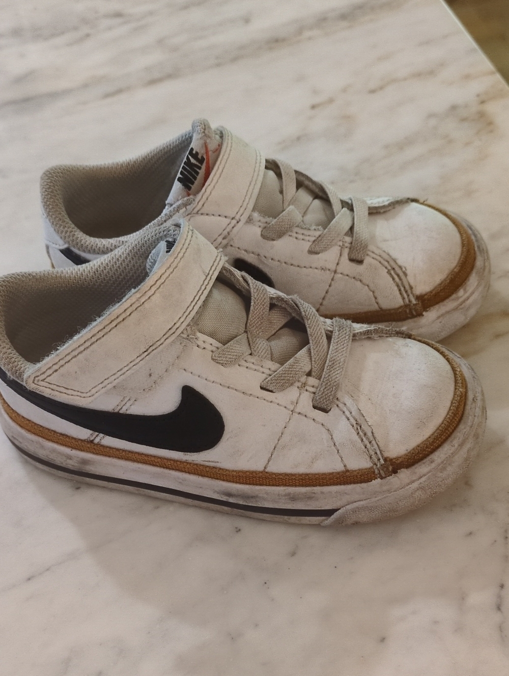 Nike Kids White Sneakers with Black Swoosh and Brown Trim
